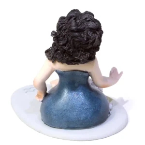 Statua in porcellana del mini Acquario di Sibania con abito blu e indaco, capelli neri e base azzurra.